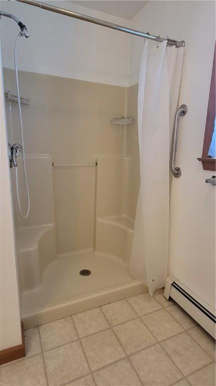 287 School Ave, Conemaugh Twp Som, PA 15937 - bathroom featuring a baseboard radiator, tile patterned flooring, and a shower stall