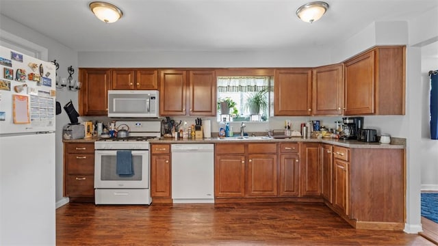 5330 Cox Ave, Lincoln Place, PA 15207 - kitchen featuring white appliances, dark wood-style floors, and brown cabinetry