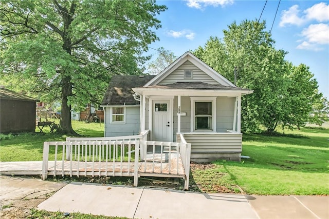 209 George St, Farrell, PA 16121 - shotgun-style home with a front lawn, a shingled roof, and a wooden deck