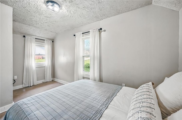 209 George St, Farrell, PA 16121 - bedroom featuring a textured ceiling, carpet flooring, and lofted ceiling
