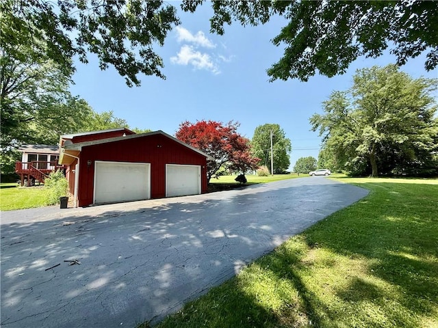 155 Anoka, Neshannock Twp, PA 16105 - view of home's exterior featuring a detached garage, a yard, and an outbuilding