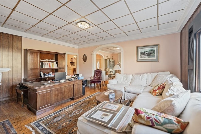 2403 Jenny Lind St, Mckeesport, PA 15132 - living area with arched walkways, light wood-type flooring, an office area, crown molding, and wood walls