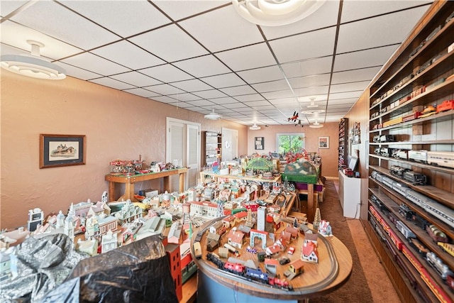 2403 Jenny Lind St, Mckeesport, PA 15132 - dining area with a drop ceiling, carpet floors, and a textured wall