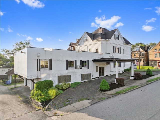 2403 Jenny Lind St, Mckeesport, PA 15132 - view of building exterior featuring a garage and asphalt driveway