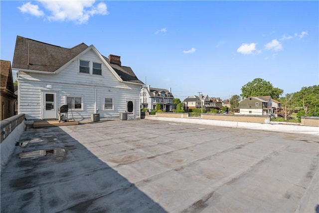 2403 Jenny Lind St, Mckeesport, PA 15132 - back of property with a chimney and a residential view