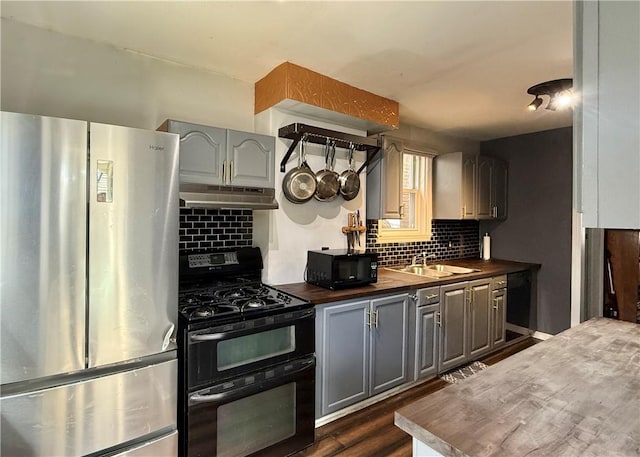 1235 Arkansas Ave, Dormont, PA 15216 - kitchen with black appliances, under cabinet range hood, wood counters, and gray cabinetry