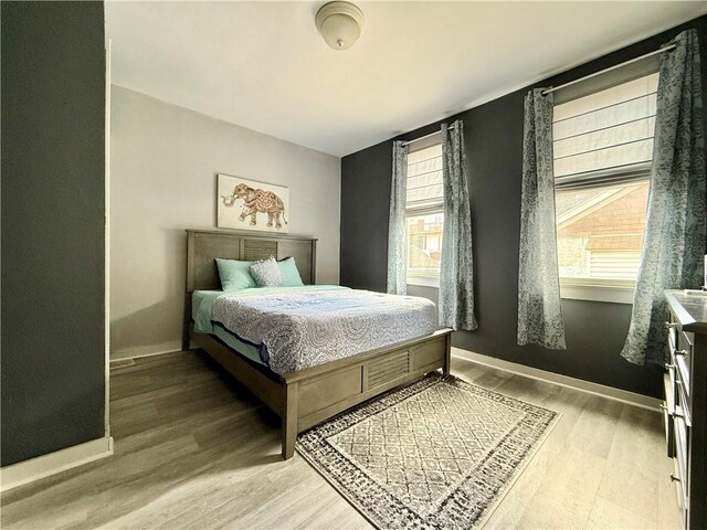 1235 Arkansas Ave, Dormont, PA 15216 - bedroom with wood finished floors and multiple windows