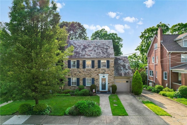 517 Keystone Dr, New Kensington, PA 15068 - view of front facade featuring a high end roof, stone siding, driveway, and a front yard