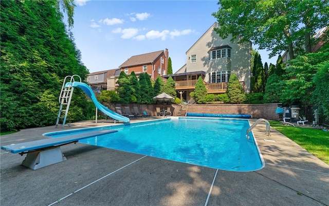 517 Keystone Dr, New Kensington, PA 15068 - view of pool with a water slide, a diving board, and a patio area