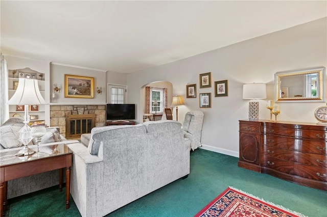 517 Keystone Dr, New Kensington, PA 15068 - living room with arched walkways, dark colored carpet, and a fireplace