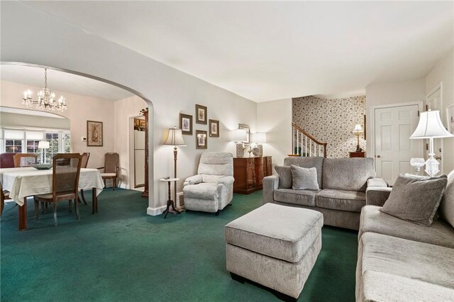 517 Keystone Dr, New Kensington, PA 15068 - living room featuring arched walkways, carpet, a chandelier, stairway, and wallpapered walls
