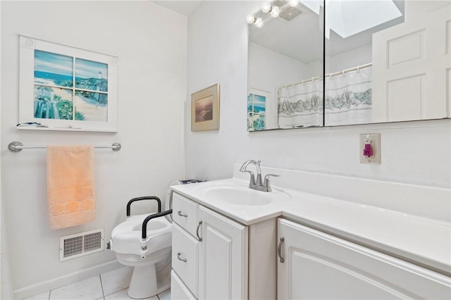 517 Keystone Dr, New Kensington, PA 15068 - bathroom with vanity, tile patterned flooring, and a skylight