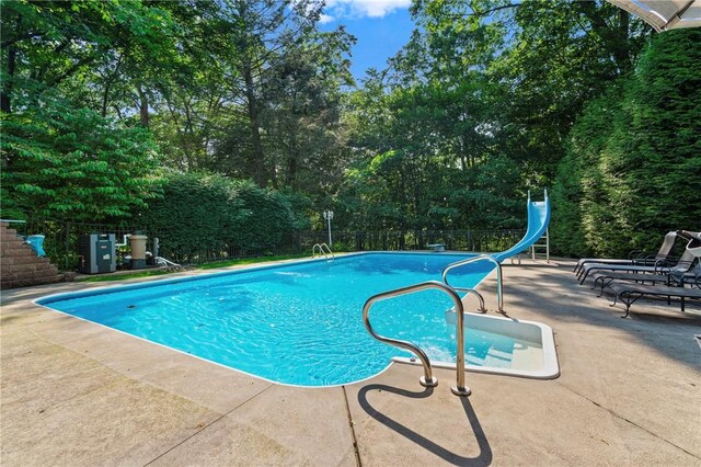 517 Keystone Dr, New Kensington, PA 15068 - view of pool with a patio, a water slide, and view of scattered trees