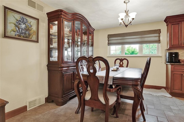 2684 3rd St, Monroeville, PA 15146 - dining space with a chandelier and light stone finish flooring