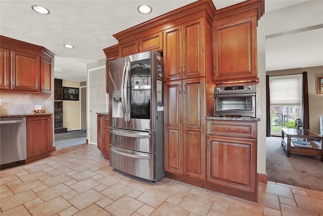2684 3rd St, Monroeville, PA 15146 - kitchen with appliances with stainless steel finishes, stone countertops, stone tile floors, recessed lighting, and backsplash