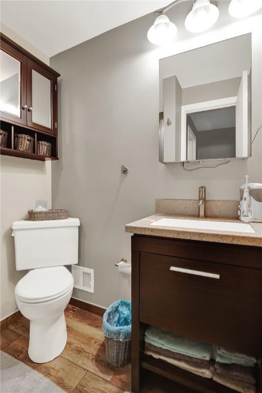 2684 3rd St, Monroeville, PA 15146 - half bathroom featuring vanity and wood finished floors