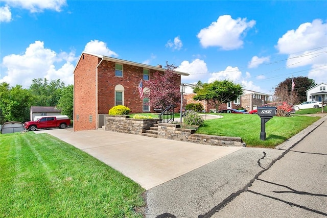 2684 3rd St, Monroeville, PA 15146 - view of front facade featuring brick siding, a front yard, and driveway