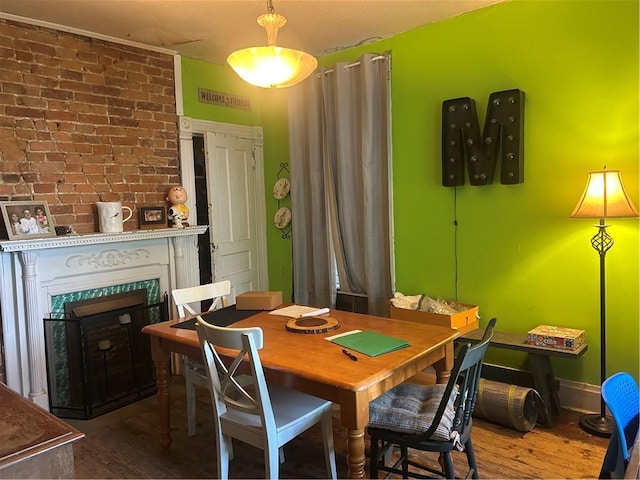 511 Arthur Ave, Scottdale, PA 15683 - dining area with wood finished floors and a fireplace