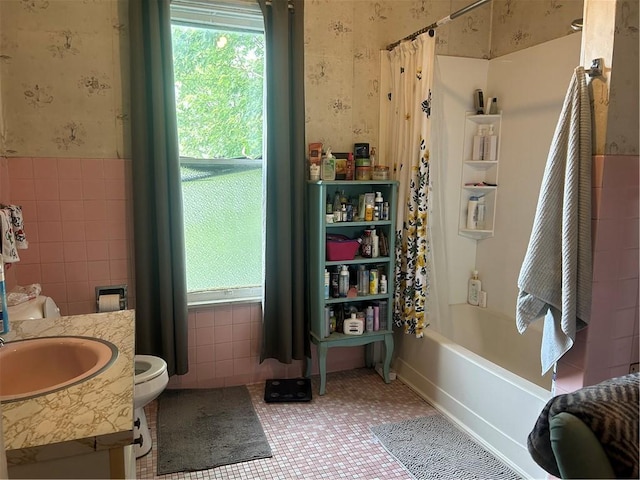 511 Arthur Ave, Scottdale, PA 15683 - bathroom featuring wallpapered walls, vanity, shower / bath combination with curtain, tile walls, and wainscoting