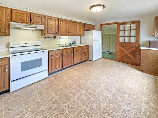 950 9th St, Taylor Twp, PA 16160 - kitchen featuring white appliances, under cabinet range hood, light countertops, and brown cabinets