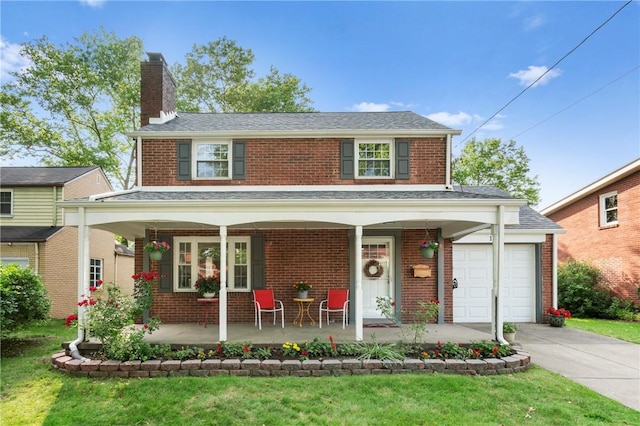 1333 Windermere Dr, Squirrel Hill, PA 15218 - view of front of home featuring a porch, brick siding, a chimney, concrete driveway, and a front lawn