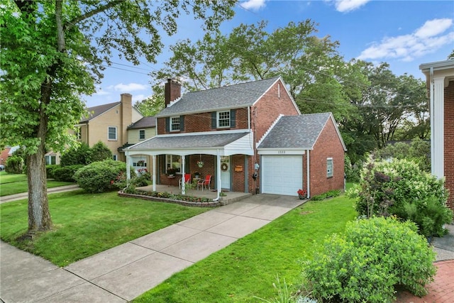 1333 Windermere Dr, Squirrel Hill, PA 15218 - view of front of home with a porch, brick siding, an attached garage, a front yard, and a chimney