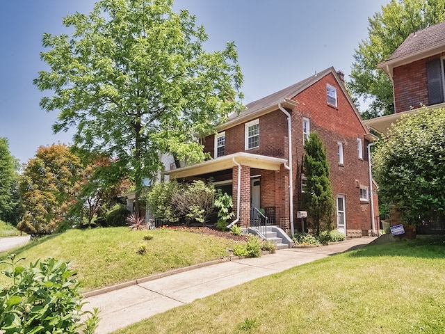 6656 Wilkins Ave, Squirrel Hill, PA 15217 - view of front of house featuring brick siding and a front lawn