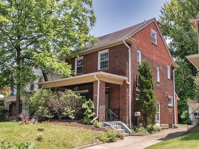 6656 Wilkins Ave, Squirrel Hill, PA 15217 - view of front of home featuring brick siding and a front lawn