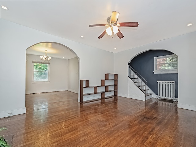 6656 Wilkins Ave, Squirrel Hill, PA 15217 - unfurnished living room with radiator, wood finished floors, ceiling fan, stairs, and recessed lighting