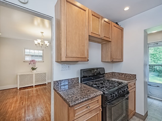 6656 Wilkins Ave, Squirrel Hill, PA 15217 - kitchen featuring black range with gas cooktop, a chandelier, dark stone counters, light wood finished floors, and recessed lighting