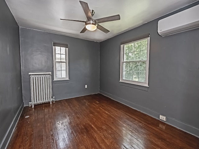 6656 Wilkins Ave, Squirrel Hill, PA 15217 - unfurnished room featuring radiator heating unit, a wall unit AC, hardwood / wood-style floors, and plenty of natural light