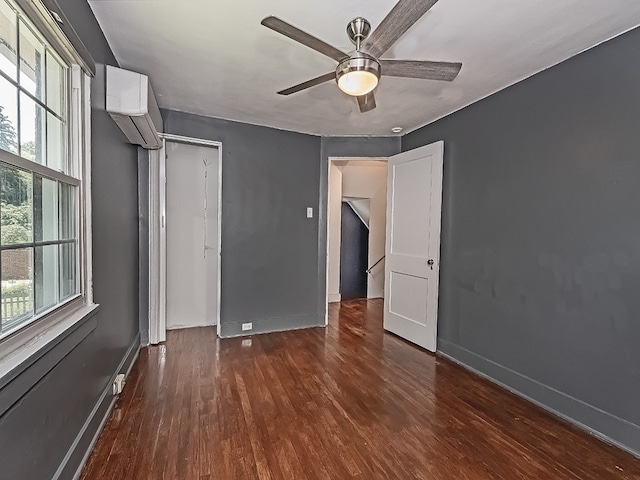 6656 Wilkins Ave, Squirrel Hill, PA 15217 - unfurnished bedroom featuring wood finished floors, multiple windows, and a ceiling fan