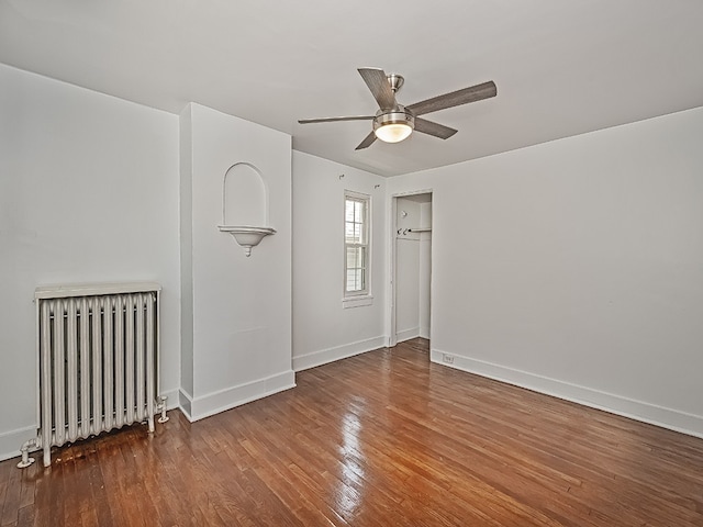 6656 Wilkins Ave, Squirrel Hill, PA 15217 - spare room with radiator, a ceiling fan, and wood finished floors
