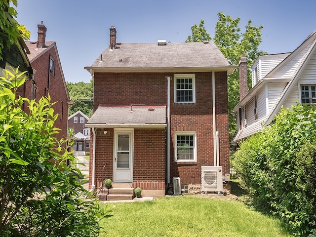 6656 Wilkins Ave, Squirrel Hill, PA 15217 - back of house featuring brick siding, a yard, a chimney, and roof with shingles