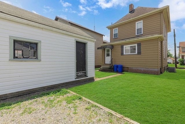 1621 4th St, New Brighton, PA 15066 - back of property with entry steps, a lawn, and a chimney