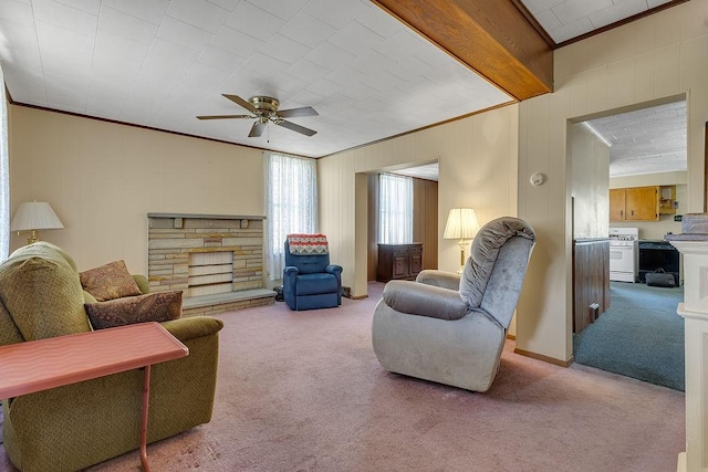 1621 4th St, New Brighton, PA 15066 - living room featuring carpet, ornamental molding, a stone fireplace, and ceiling fan
