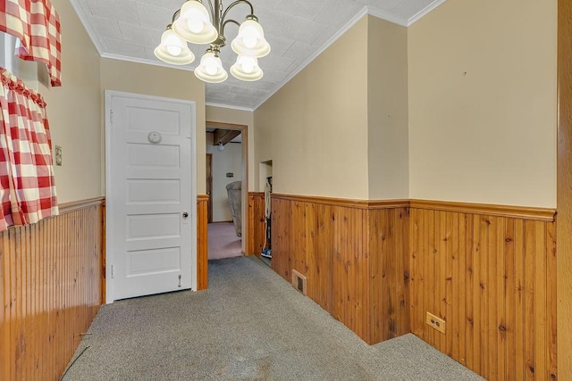 1621 4th St, New Brighton, PA 15066 - hall featuring carpet, wainscoting, a chandelier, crown molding, and wood walls