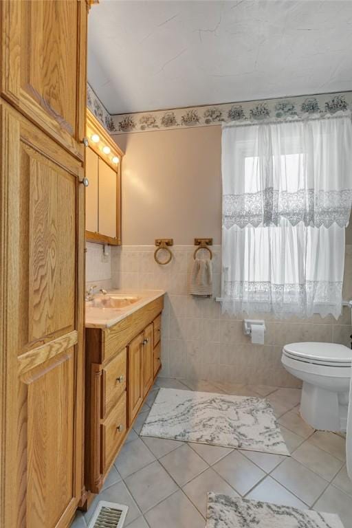 1621 4th St, New Brighton, PA 15066 - bathroom with vanity, tile walls, tile patterned floors, and a wainscoted wall