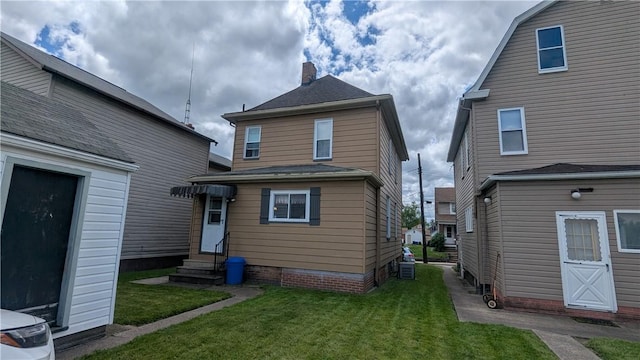 1621 4th St, New Brighton, PA 15066 - back of property with entry steps, a lawn, and a chimney