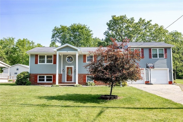 453 Falls Ave, Neshannock Twp, PA 16105 - bi-level home with driveway, an attached garage, a front lawn, and brick siding