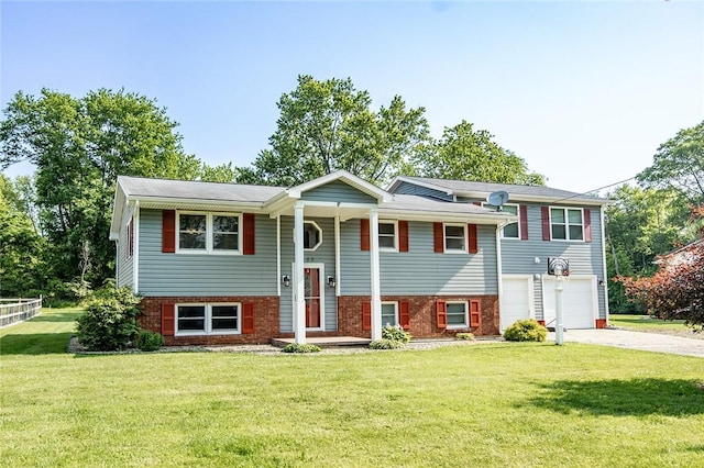453 Falls Ave, Neshannock Twp, PA 16105 - bi-level home with driveway, a garage, brick siding, and a front yard