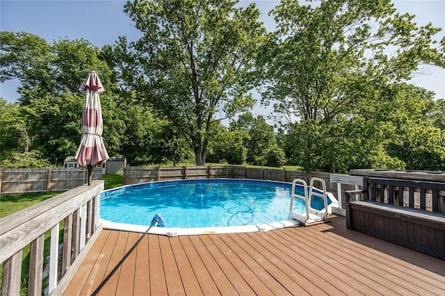 453 Falls Ave, Neshannock Twp, PA 16105 - view of pool featuring a wooden deck, view of scattered trees, and a fenced backyard