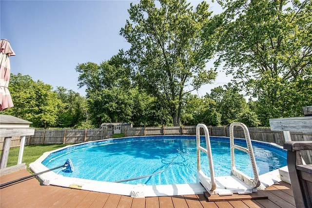 453 Falls Ave, Neshannock Twp, PA 16105 - view of swimming pool featuring a deck, a fenced backyard, and view of wooded area