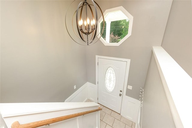 453 Falls Ave, Neshannock Twp, PA 16105 - entrance foyer with a chandelier, plenty of natural light, light tile patterned floors, and wainscoting