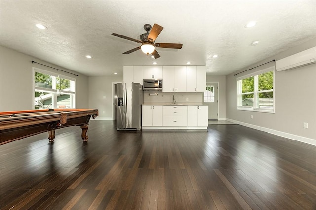 453 Falls Ave, Neshannock Twp, PA 16105 - playroom featuring a wall mounted air conditioner, healthy amount of natural light, recessed lighting, ceiling fan, and dark wood-style floors