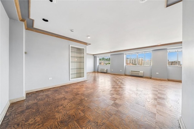 128 N Craig St Unit 703, Oakland, PA 15213 - spare room with a wall unit AC and ornamental molding