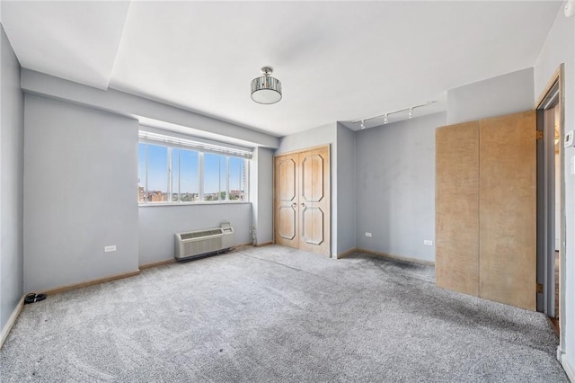 128 N Craig St Unit 703, Oakland, PA 15213 - unfurnished bedroom with carpet flooring, an AC wall unit, and track lighting