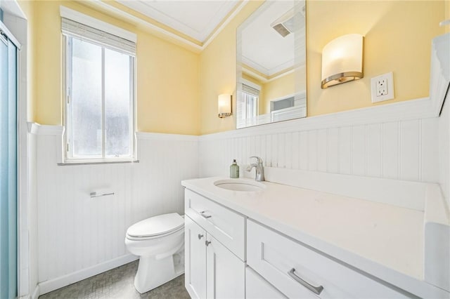 128 N Craig St Unit 703, Oakland, PA 15213 - bathroom featuring wainscoting, vanity, healthy amount of natural light, ornamental molding, and a decorative wall