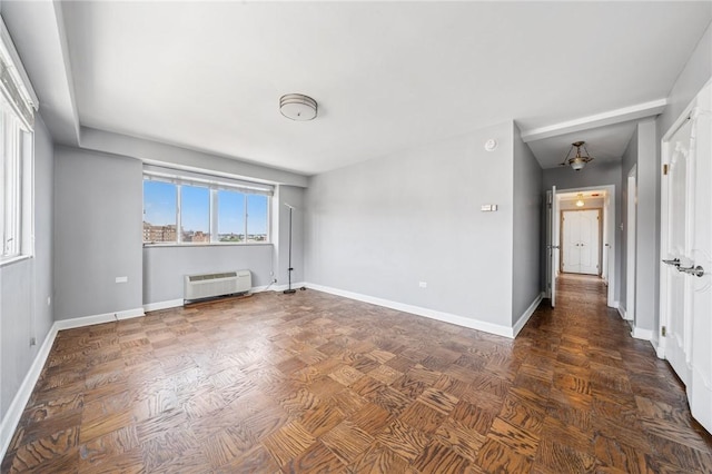 128 N Craig St Unit 703, Oakland, PA 15213 - spare room with a wall unit AC and baseboards