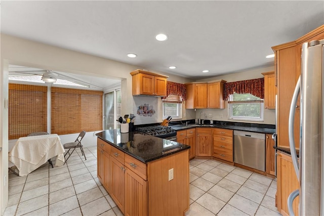 1922 Shady Oak Dr, Mccandless, PA 15101 - kitchen with appliances with stainless steel finishes, light tile patterned floors, recessed lighting, dark stone countertops, and a peninsula